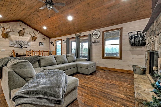 living room with lofted ceiling, wood ceiling, and wooden walls