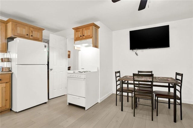 kitchen featuring premium range hood, white appliances, light wood-type flooring, and ceiling fan