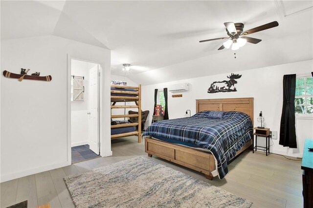 bedroom with light hardwood / wood-style flooring, ensuite bath, and ceiling fan