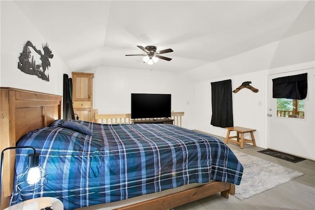 bedroom featuring wood-type flooring, ceiling fan, and lofted ceiling