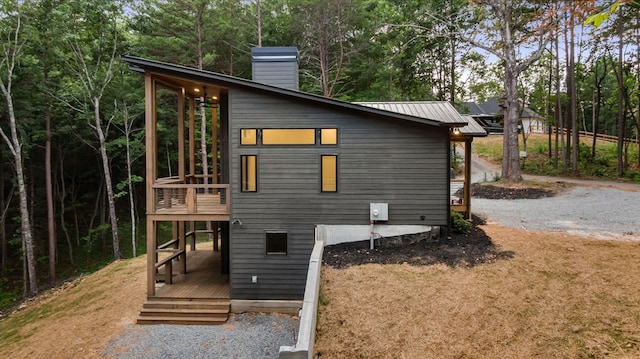 view of property exterior featuring a deck