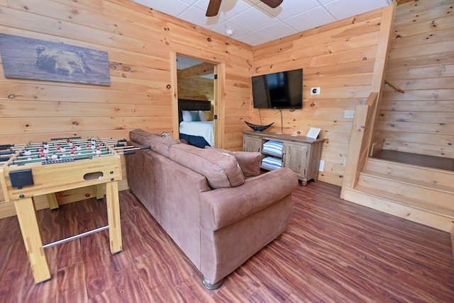 73 Rosiey Ln, Blue Ridge, GA 30513 - living room featuring wood finished floors, ceiling fan, wooden walls, and stairway