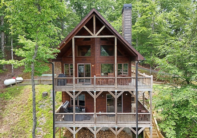 73 Rosiey Ln, Blue Ridge, GA 30513 - view of front of house featuring a chimney and a wooden deck