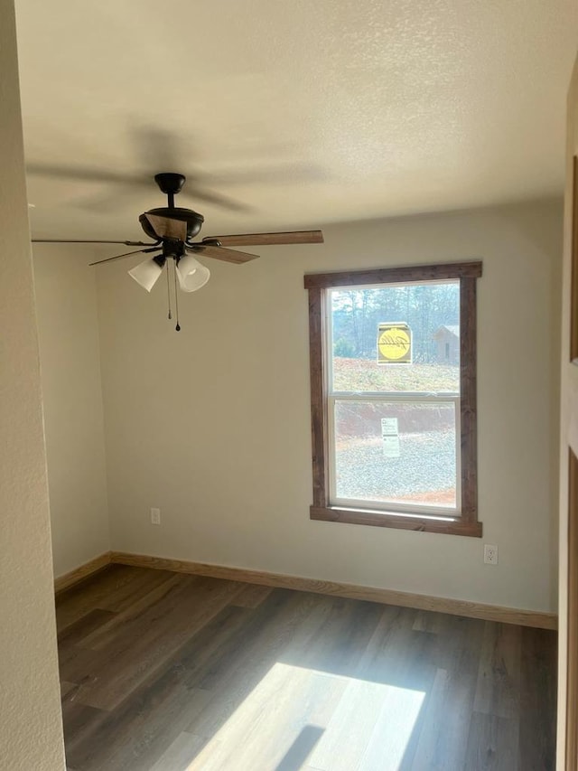 unfurnished room with wood-type flooring and ceiling fan