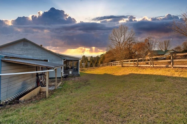 view of yard at dusk