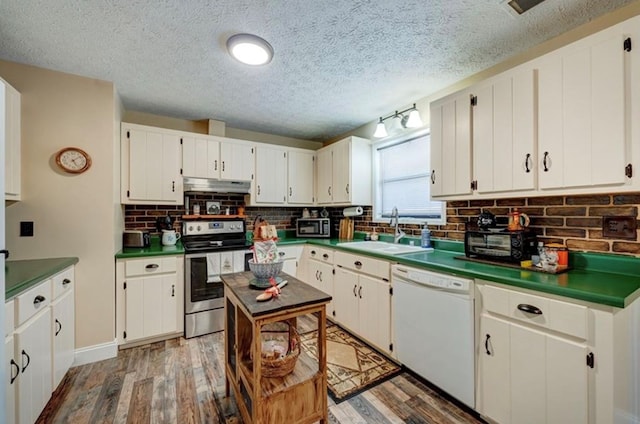 kitchen with stainless steel electric range oven, hardwood / wood-style floors, dishwasher, sink, and white cabinets