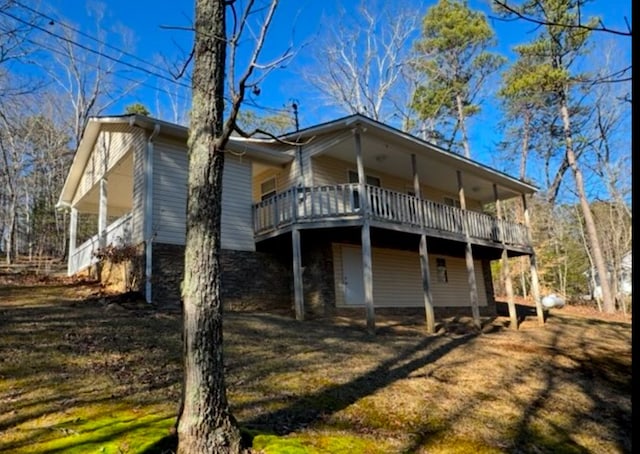 exterior space featuring a yard and a deck