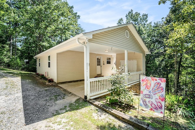 view of property exterior with covered porch