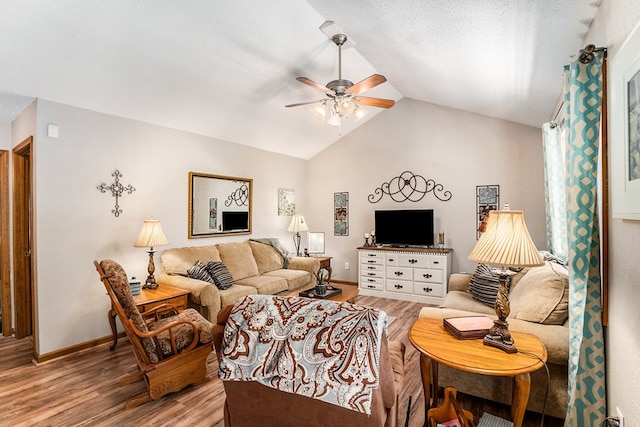 living room featuring vaulted ceiling, hardwood / wood-style floors, a textured ceiling, and ceiling fan