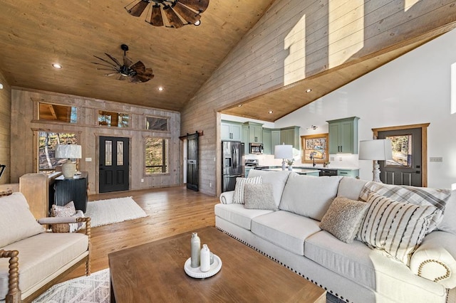LOT11 Windy Valley Trl, Blue Ridge, GA 30513 - living area featuring high vaulted ceiling, ceiling fan, light wood-style floors, wood ceiling, and wood walls