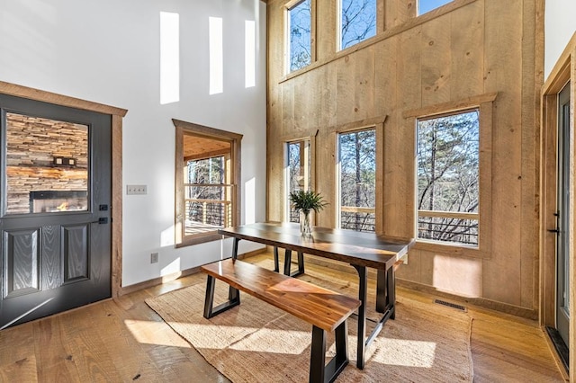 LOT11 Windy Valley Trl, Blue Ridge, GA 30513 - dining area featuring a high ceiling, wood-type flooring, and baseboards