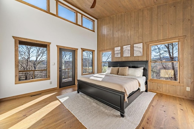 LOT11 Windy Valley Trl, Blue Ridge, GA 30513 - bedroom with a high ceiling, access to exterior, wooden ceiling, wood-type flooring, and multiple windows