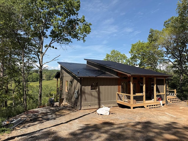 LOT11 Windy Valley Trl, Blue Ridge, GA 30513 - view of side of property with board and batten siding, metal roof, and a deck