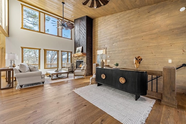 LOT11 Windy Valley Trl, Blue Ridge, GA 30513 - living area with a towering ceiling, wooden ceiling, ceiling fan, plenty of natural light, and a stone fireplace