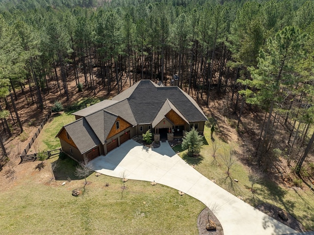 drone / aerial view featuring a view of trees