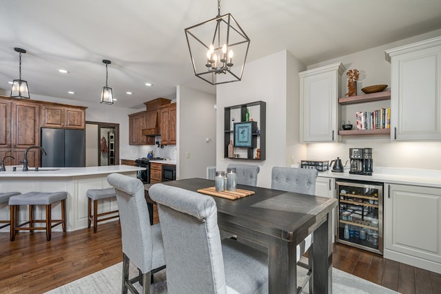 dining room with wine cooler, dark wood-style flooring, and recessed lighting