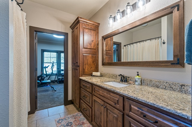 bathroom featuring tile patterned flooring and vanity