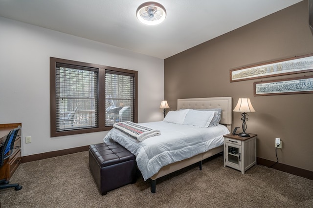 bedroom with carpet and baseboards