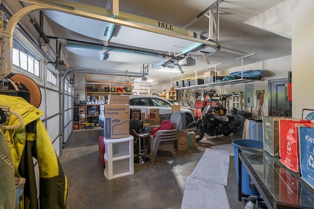 garage with a garage door opener and electric panel