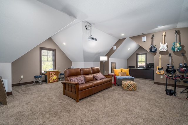 home theater room featuring vaulted ceiling, plenty of natural light, carpet flooring, and baseboards