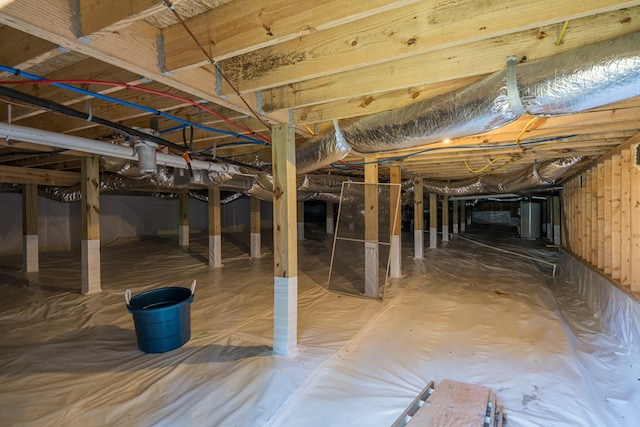 basement featuring water heater and crawl space