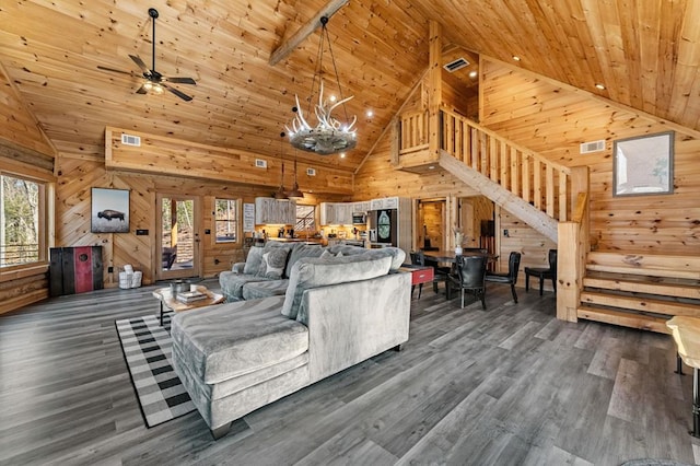 living room featuring dark hardwood / wood-style flooring, ceiling fan, wood ceiling, and wood walls