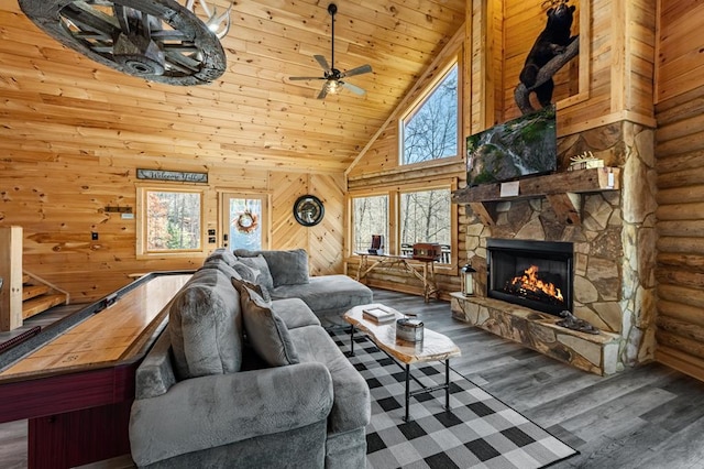 living room with high vaulted ceiling, a fireplace, hardwood / wood-style flooring, ceiling fan, and wood ceiling