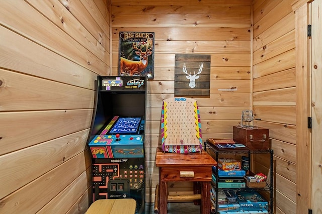 game room with wood walls