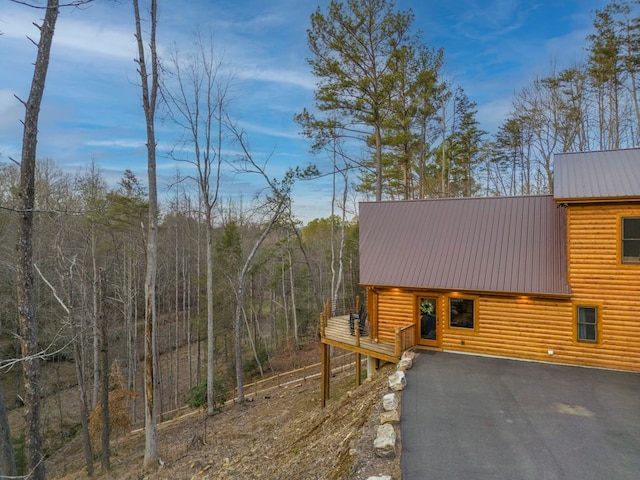 view of home's exterior with a wooden deck