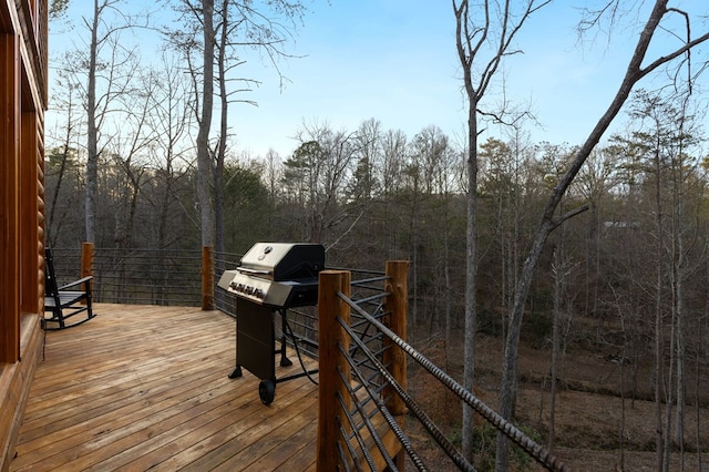 wooden terrace featuring grilling area