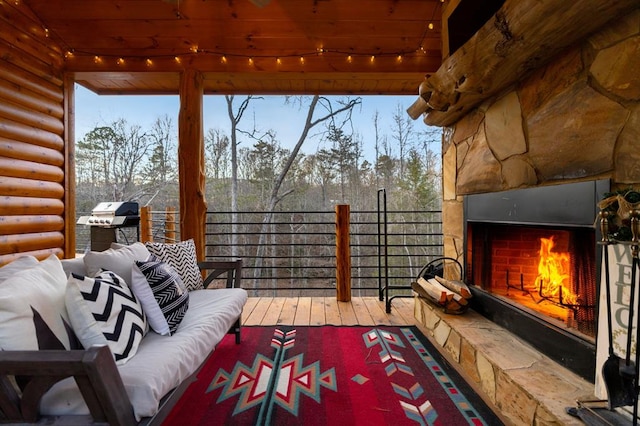 exterior space with an outdoor living space with a fireplace