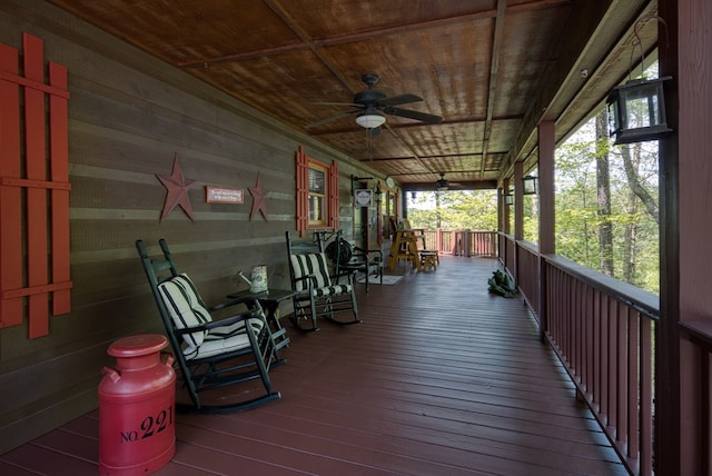 deck featuring covered porch and a ceiling fan