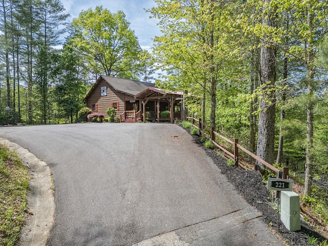 view of side of property with aphalt driveway