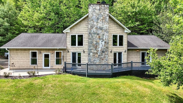 520 Brasstown Rd, Murphy, NC 28906 - rear view of house with a chimney, a deck, roof with shingles, and a lawn