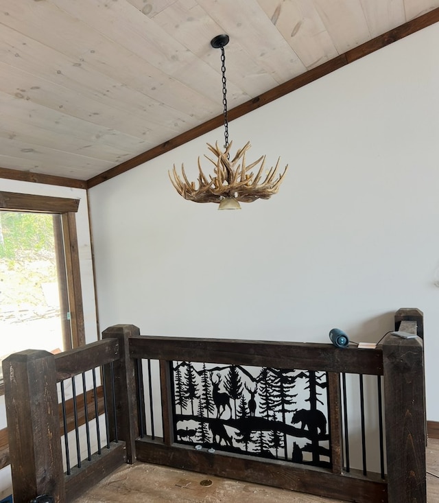 detailed view of wood ceiling, a chandelier, and crown molding