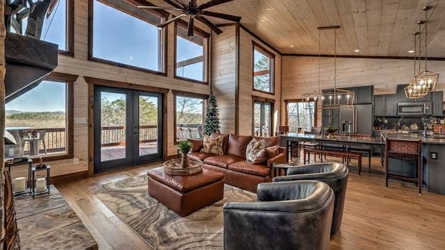 living room with wood ceiling, high vaulted ceiling, light wood-style floors, french doors, and a chandelier