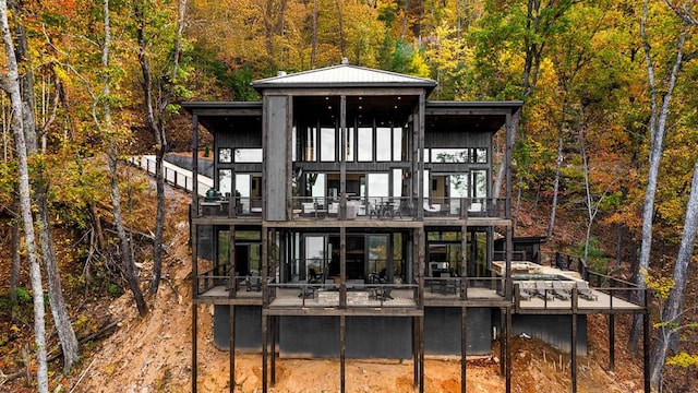 rear view of property with a balcony