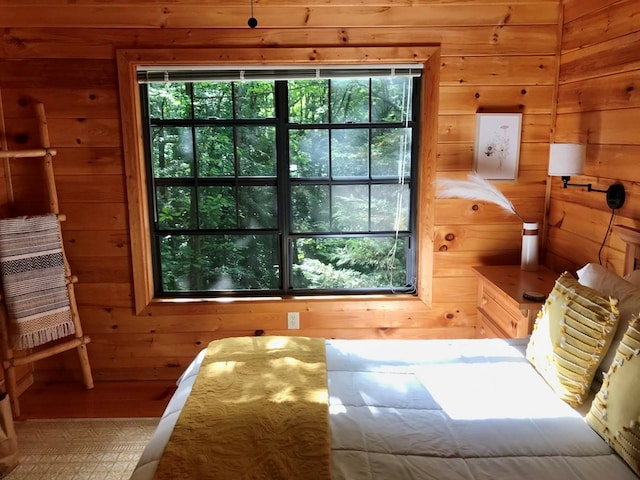 bedroom featuring wood walls