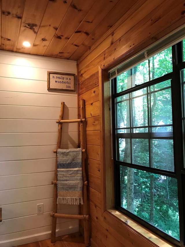 interior space with wooden walls and wood ceiling