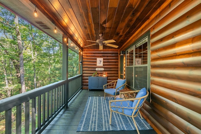 unfurnished sunroom with wooden ceiling and ceiling fan