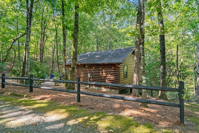 view of side of property featuring an outdoor structure