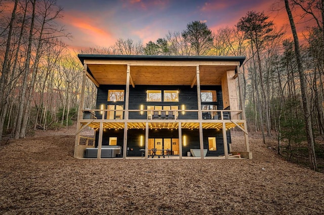 view of back of house at dusk