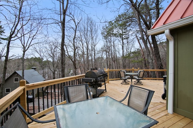 wooden terrace with area for grilling