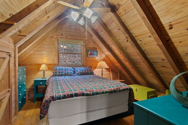 unfurnished bedroom featuring vaulted ceiling with beams, wooden walls, hardwood / wood-style floors, and wooden ceiling