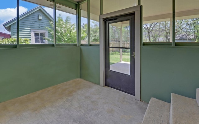 unfurnished sunroom with a wealth of natural light
