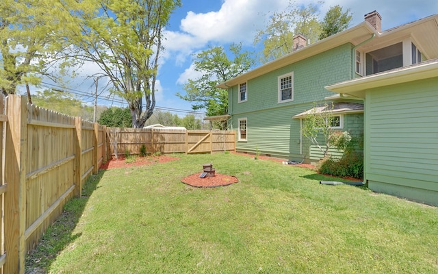 view of yard with a fenced backyard