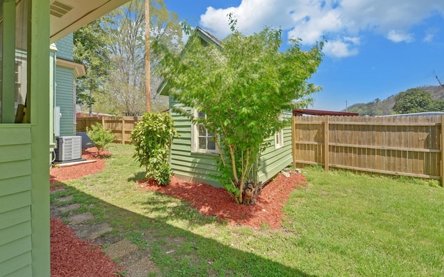 view of yard featuring central air condition unit and fence private yard