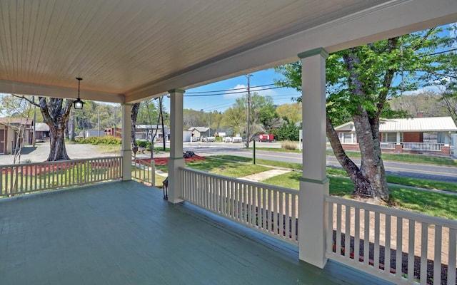 view of patio / terrace with a porch and a residential view