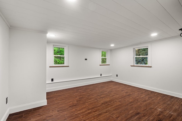basement with baseboards, recessed lighting, and wood finished floors