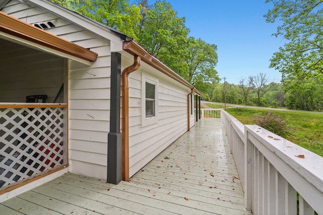 view of home's exterior with a wooden deck